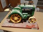 Hand crafted tractor on wood slab