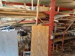 Large lot of various lumber and metal pipe.