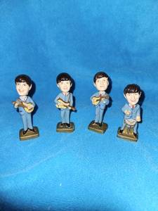 lot 149 image: Vintage Beatles Bobblehead cake toppers