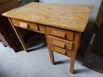 Wooden desk with 4 drawers and no contents.
