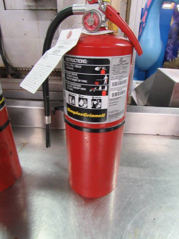 lot 5582 image: Simplex Grinnell ABC Fire Extinguisher