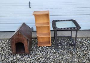lot 32 image: Small Doghouse, Patio Table, and Bookshelf