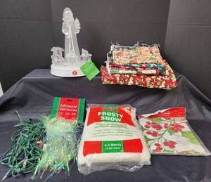 lot 303 image: LED Acrylic Musical Rotating Santa, Christmas Tablecloth, Material, Snow, and Icicles