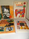 Singer sewinf book & toy & miniature/sewing machines.