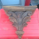 Carved wood wall shelf as picture