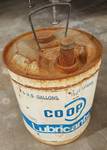 Crusty and surface rusty is this 5 gallon Coop Lubrication metal can