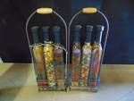 (2) sets of pickles edibles in decorative glass bottles w/ wire holders
