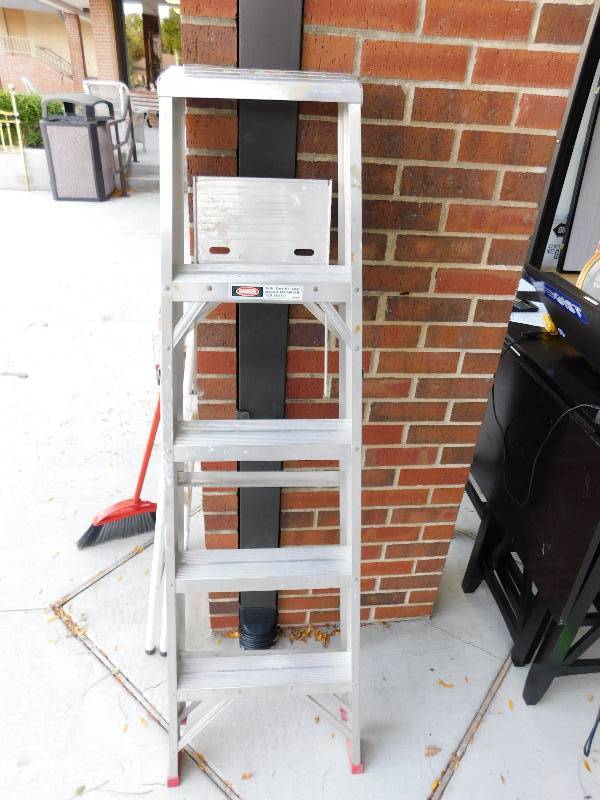 lot 8289 image: 5 Foot Fold and Storage Metallic Ladder.