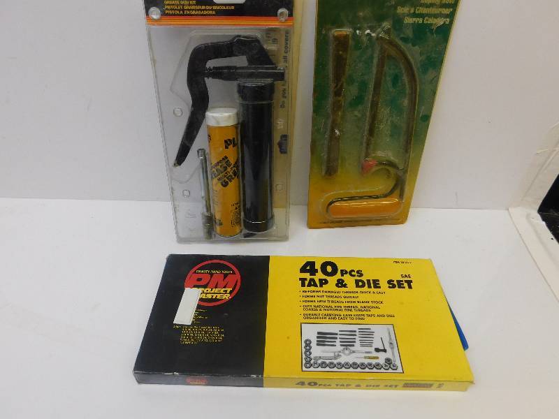 lot 8046 image: New In Packages  40 Pcs Tap and Die Set. Grease Gun w Refill. Chopping Saw.