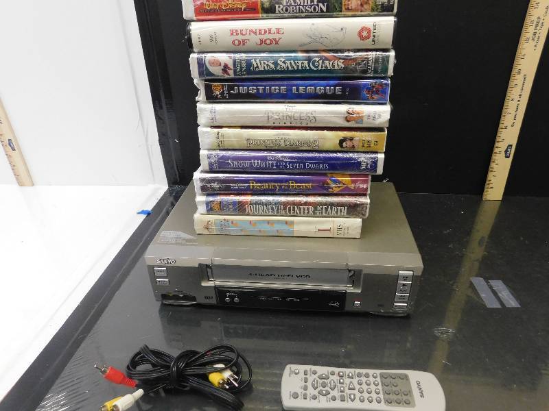 lot 8072 image: Sanyo 4 Head VHS Player (Works)  10 VHS Tapes.