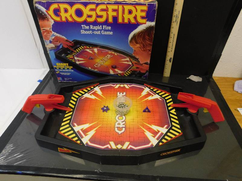 lot 8136 image: Vintage Crossfire Tabletop Game. Complete with 55 Ball Ammo and 2 Pucks. With Box.