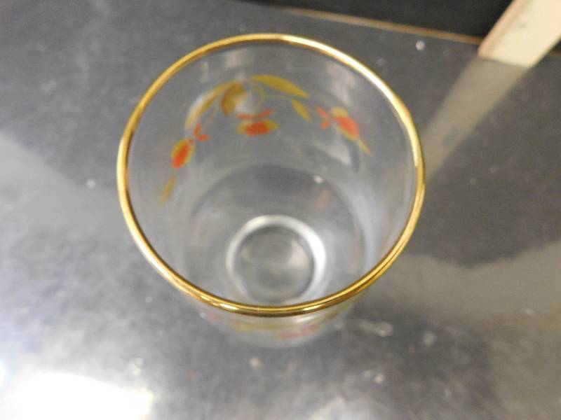 lot 8176 image: HALLs Superior Quality Kitchenware.  7 Clear Glass Gold Rimmed Juice Cups.