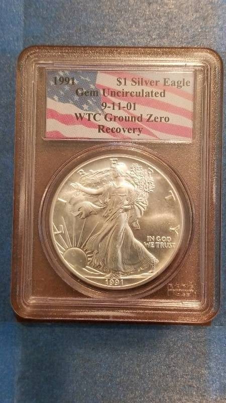 lot 784 image: 1991 American Silver Eagle 9-11-01 WTC Ground Zero Coin