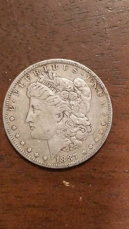 lot 713 image: 1887 Morgan Silver Dollar