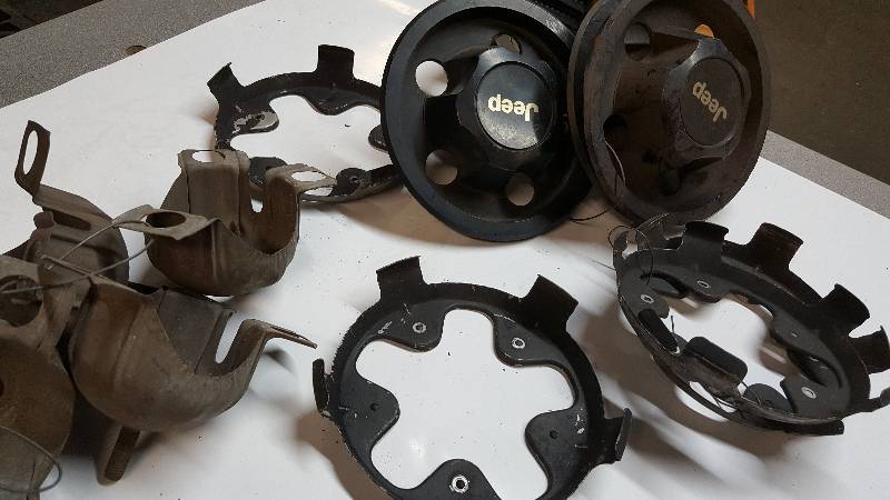 lot 6398 image: Miscellaneous Jeep hub caps and assorted brackets for other caps and covers