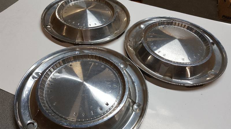lot 6402 image: 3 60s Pontiac wheel covers