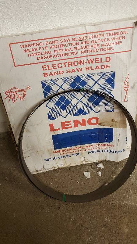 lot 6373 image: Brand spankin new is this 1-12 wide Lenox band saw blade finished and ready to go on your saw.  Not sure of the length