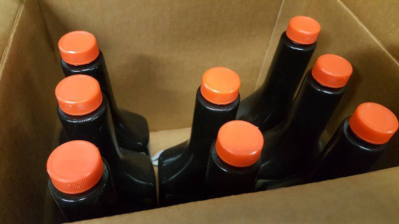 lot 6341 image: 8 new bottles of the Champion HiTech all season Diesel Flow fuel conditioner.