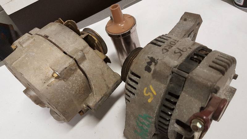 lot 6349 image: Couple of Ford (one big truck) alternators and a chrome 12 volt Accel ignition coil