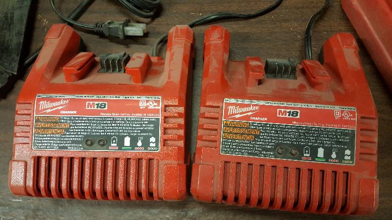 lot 6353 image: This pair of Milwaukee M18 power tool chargers actually dont look like theyve ever been used