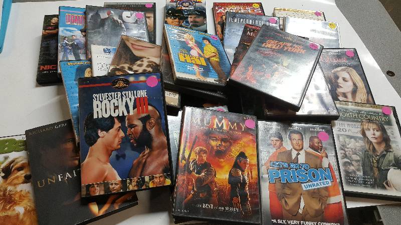 lot 6303 image: Wow what a selection of DVDs and 1 VHS tape.  You could run a month long movie marathon and still not see all of them
