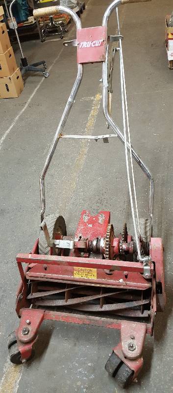 lot 6305 image: I believe this is a 20 cut reel blade Tru-Cut mower deck complete except for a side shaft drive 5-8 horsepower motor.