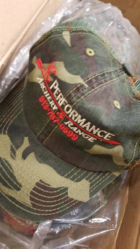 lot 6275 image: 24 new in the box Promo Camo hats promoting KC Performance Archery & Range