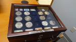 The complete collection of Eisenhower dollar coins w/stamps in very nice wood case missing 1 coin & 5 stamps all coins 1970's.