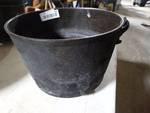 Cast iron pot with handle.
