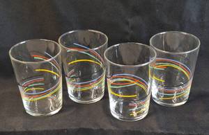 lot 56 image: Vintage Glass Set of 4 Glasses Cups Tumblers Black Blue Red Yellow Green Swirl Stripe 12 oz