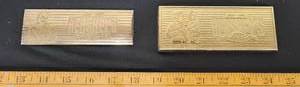 lot 118 image: 2- 100th Year Anniversary Hersheys gold tone brass bars