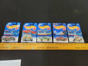 lot 153 image: 5- Hot Wheels- 3- Tropical Series, 1-Flyin Aces Series, 1-Quick Silver Series