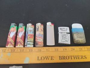 lot 289 image: 5- BIC lighters, Zip- One lighter and a Korea stamped lighter