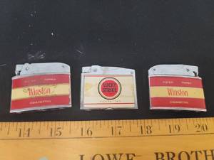 lot 292 image: 2- Vintage Winston lighters and a vintage Lucky Strike lighter