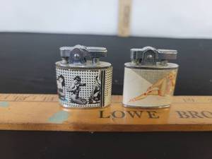 lot 293 image: 2-Vintage pin-up lighters