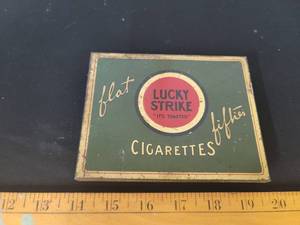 lot 295 image: Lucky Strike cigarette tin