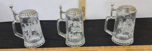 lot 334 image: 2- Rustic Buck And Heraldic Shield Glass Beer Stein And Glass Golfer Stein