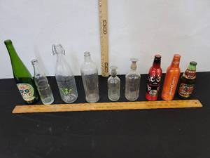 lot 351 image: 9- Alcohol Bottles