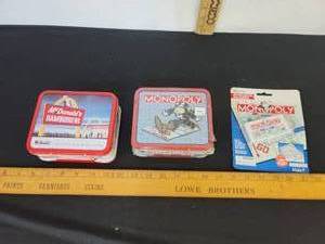 lot 423 image: Monopoly Keychain, McDonalds Tin And Monopoly Tin