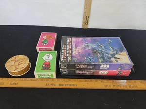 lot 481 image: Transformers Puzzles, Peanuts Puzzles And A Small Puzzle