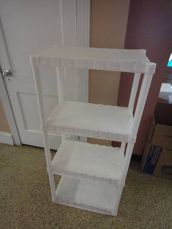 lot 1570 image: 4 Tiered Plastic Storage Shelf