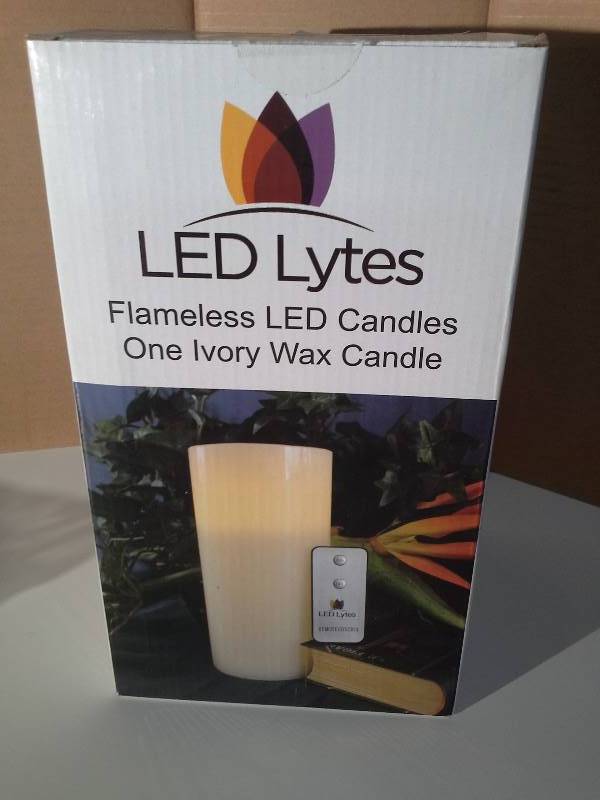 lot 6112 image: LED Lytes Flameless Candle, Battery Operated Pillar with Remote, A Tall 8 X 4 Ivory Colored Wax with a Flickering Soft Pale Yellow Flame for Wedding Decorations, Brides, Parties, Gifts