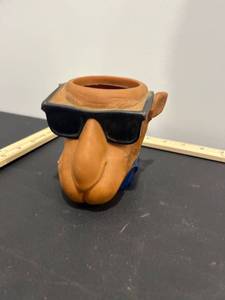 lot 1013 image: 1991 Vintage Camel Joe Cool Smooth Character Camel Cigarettes Can Holder