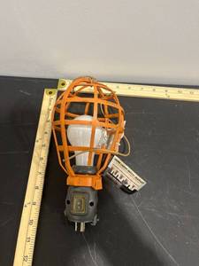 lot 1137 image: RIDGID Work Lighting 15 Amp Work Light Basket Guard with 1-Outlet 612-WLBR (Powers On)