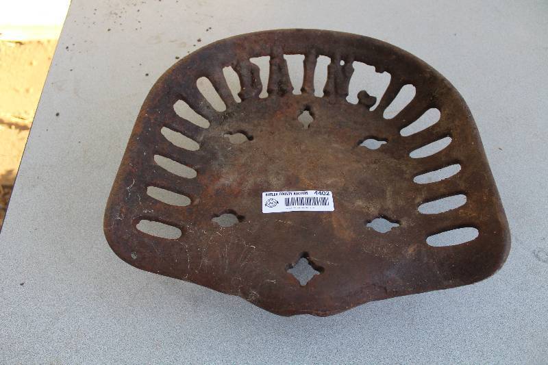 lot 4402 image: Vintage Cast Iron Implement Tractor Seat - COOL
