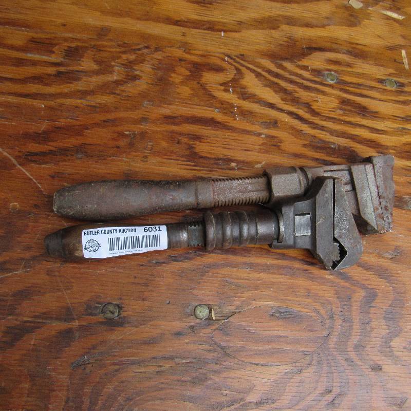 lot 6031 image: Adjustable Wrenches - 1 w pipe wrench jaw and one is a straight wrench