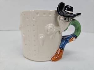 lot 366 image: 1980 Fitz & Floyd Ceramic Bad Guy Cowboy Mug