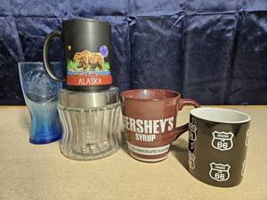 lot 5051 image: Assortment of mugs, mcdonalds glass, and glass storage jar