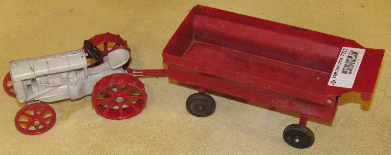 lot 7022 image: Metal Toy Replica Gray Tractor w red tires and Red Grain Cart - Good Condition w minor paint scratches - see photos