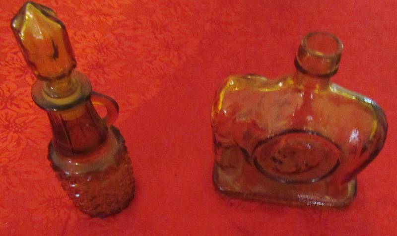 lot 7966 image: Lot of 2 Amber Carnival Glass Bottles - 1 w glass stopper - 1 coin glass ()
